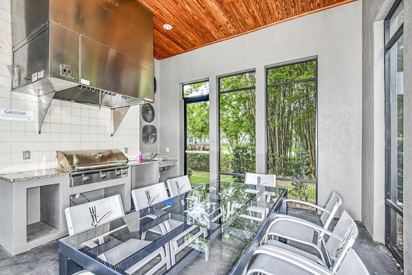 Clubhouse with elegant seating and modern decor at Windermere Cay Apartments, a Greystar luxury community