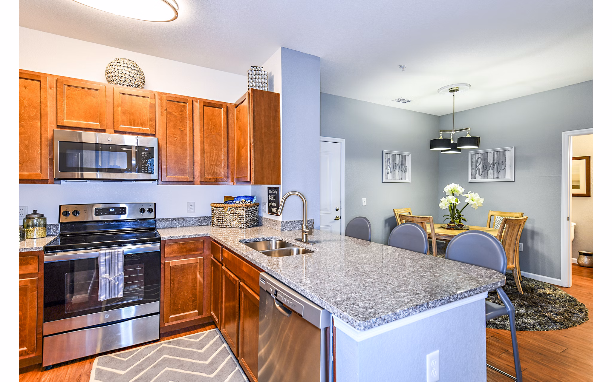 Modern kitchen with stainless steel appliances at Windermere Cay Apartments