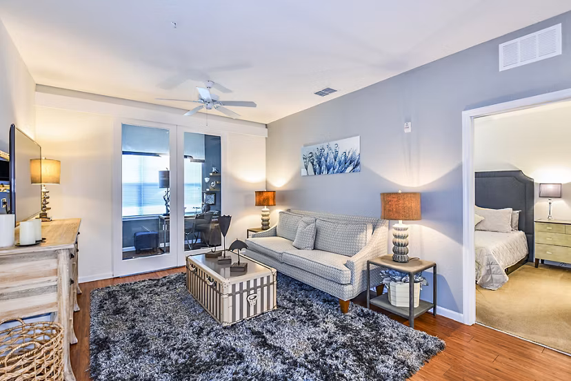 Spacious living room with modern furnishings in Windermere Cay Apartments