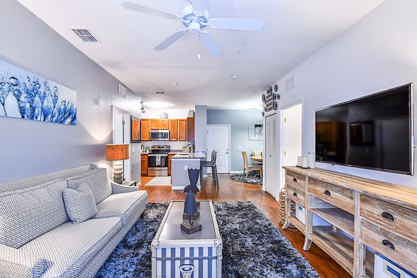 Cozy living room with modern decor and a spacious layout in Windermere Cay Apartments