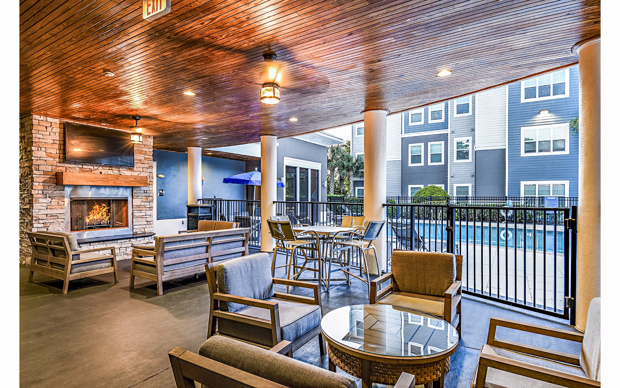 Fire pit and patio area at Windermere Cay Apartments offering cozy outdoor seating for socializing and relaxation