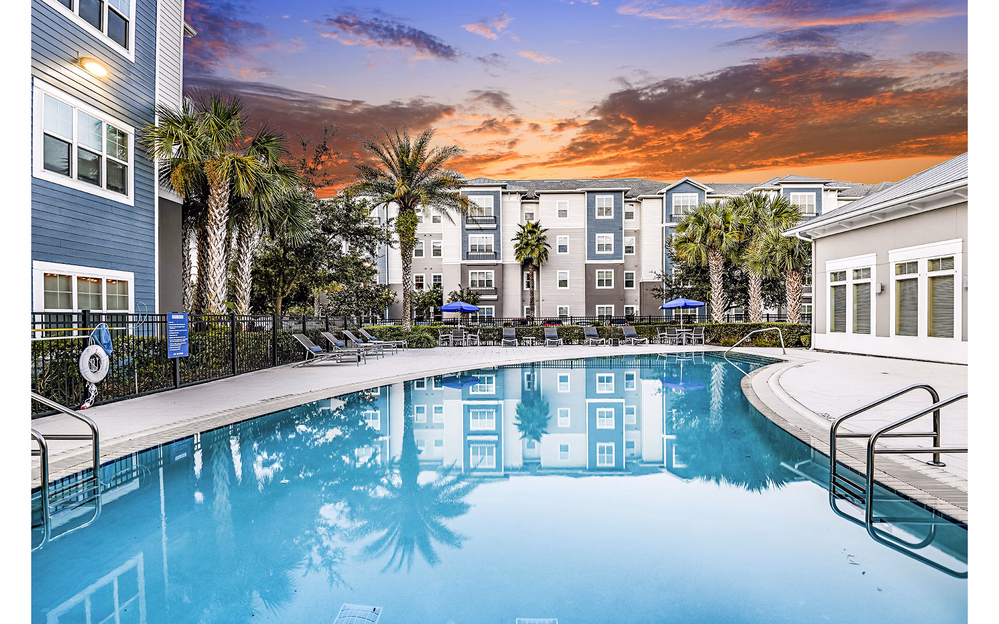 Spacious patio with modern furniture at Windermere Cay Apartments, ideal for relaxation and social gatherings in the vibrant community setting