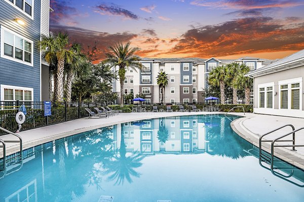 Spacious patio with modern furniture at Windermere Cay Apartments, ideal for relaxation and social gatherings in the vibrant community setting