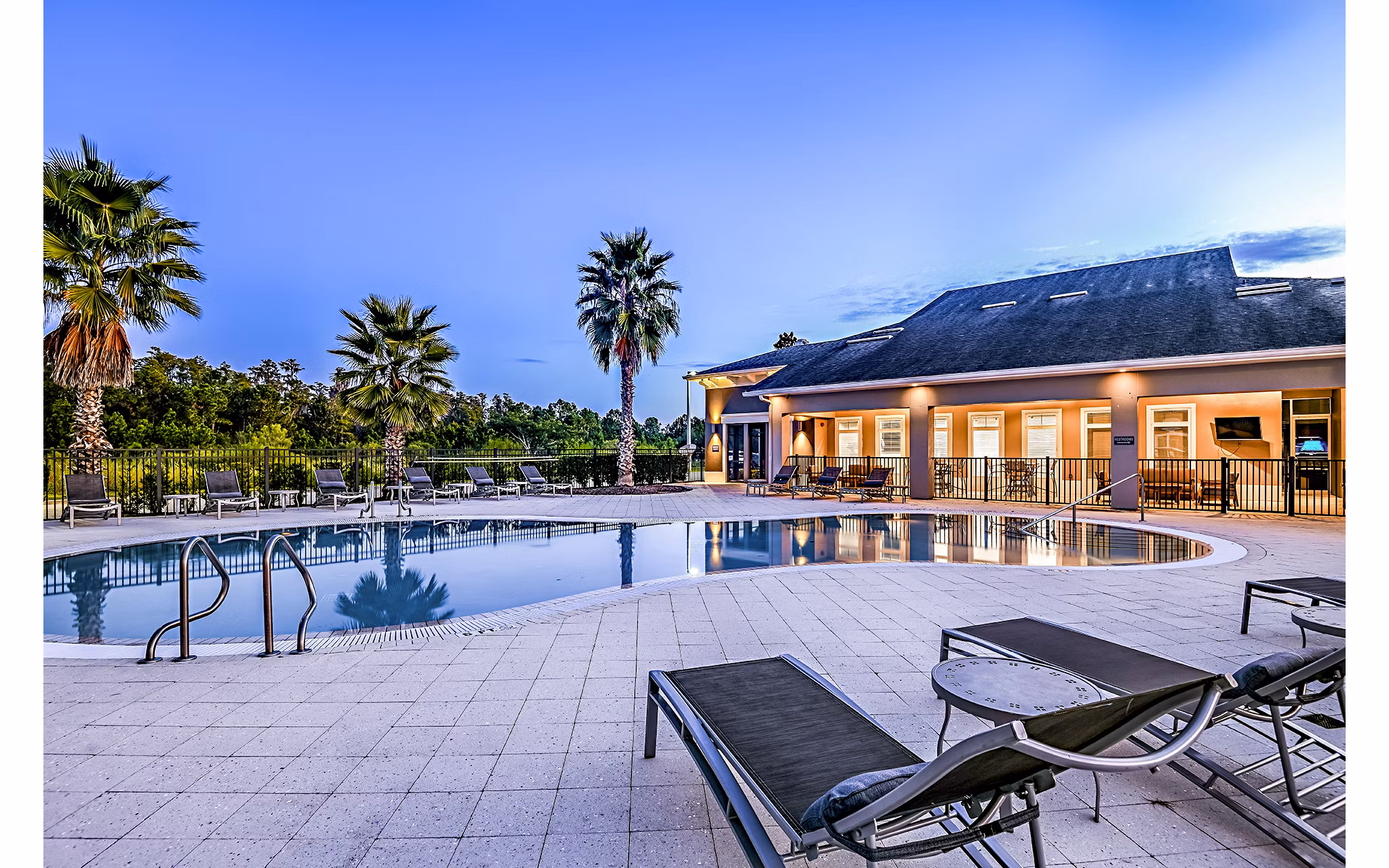 Pool with sun loungers at Windermere Cay Apartments Luxury apartments