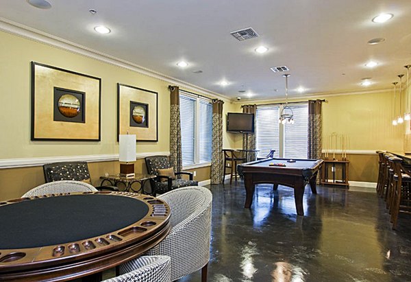 Aqua at Millenia Apartments: Elegant clubhouse with modern seating and ambient lighting in a luxury Orlando community