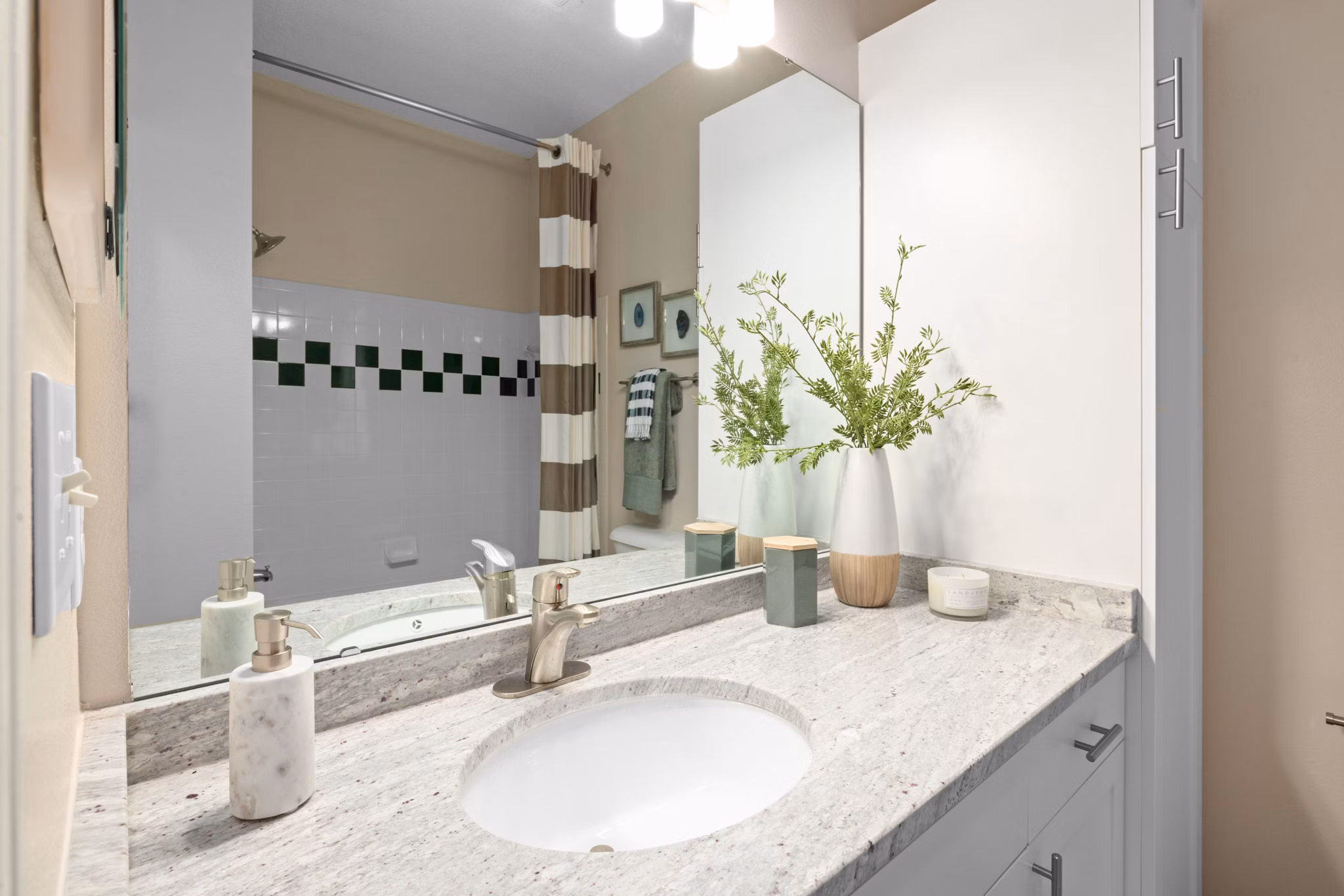 Bathroom with modern fixtures and tiled shower at The Morgan at Chapel Hill Apartments, offering luxury living spaces