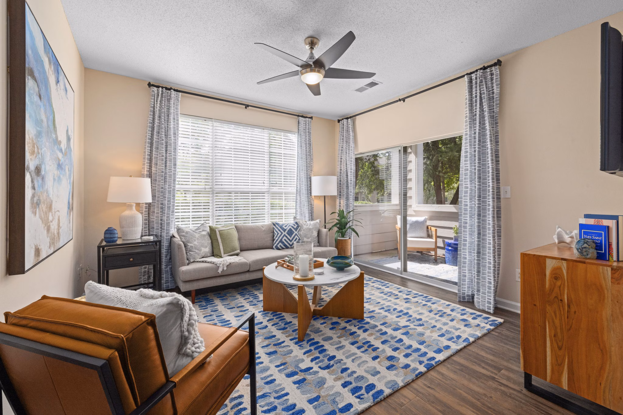 Spacious living room with modern furnishings at The Morgan at Chapel Hill Apartments, showcasing luxury apartments by Greystar