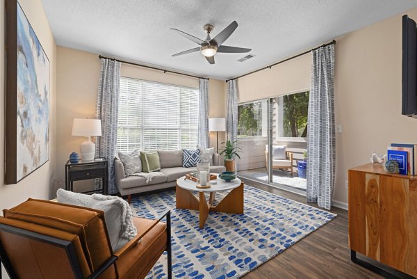 Spacious living room with modern furnishings at The Morgan at Chapel Hill Apartments, showcasing luxury apartments by Greystar