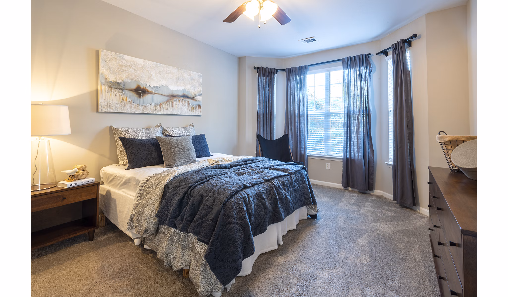 Spacious bedroom with modern decor at Wakefield Glen Apartments in North Carolina