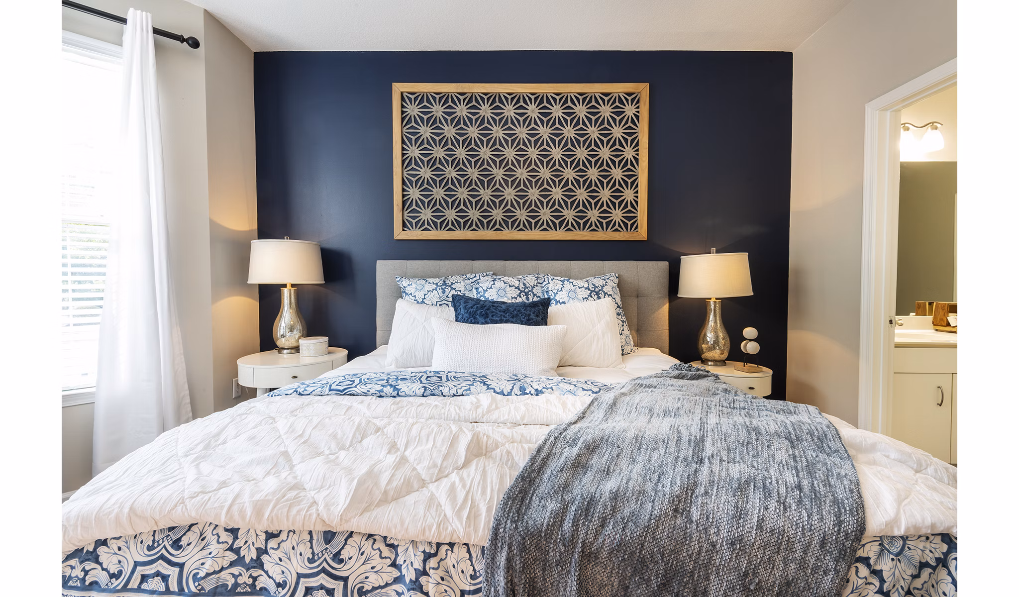 Bedroom with sleek design and cozy ambiance at Wakefield Glen Apartments, Greystar luxury apartments in a serene location