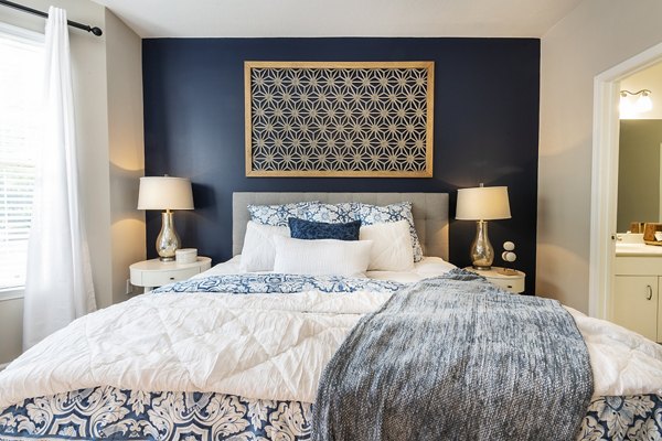 Bedroom with sleek design and cozy ambiance at Wakefield Glen Apartments, Greystar luxury apartments in a serene location