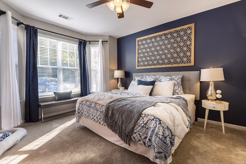 Wakefield Glen Apartments: Cozy bedroom with modern decor and ample natural light