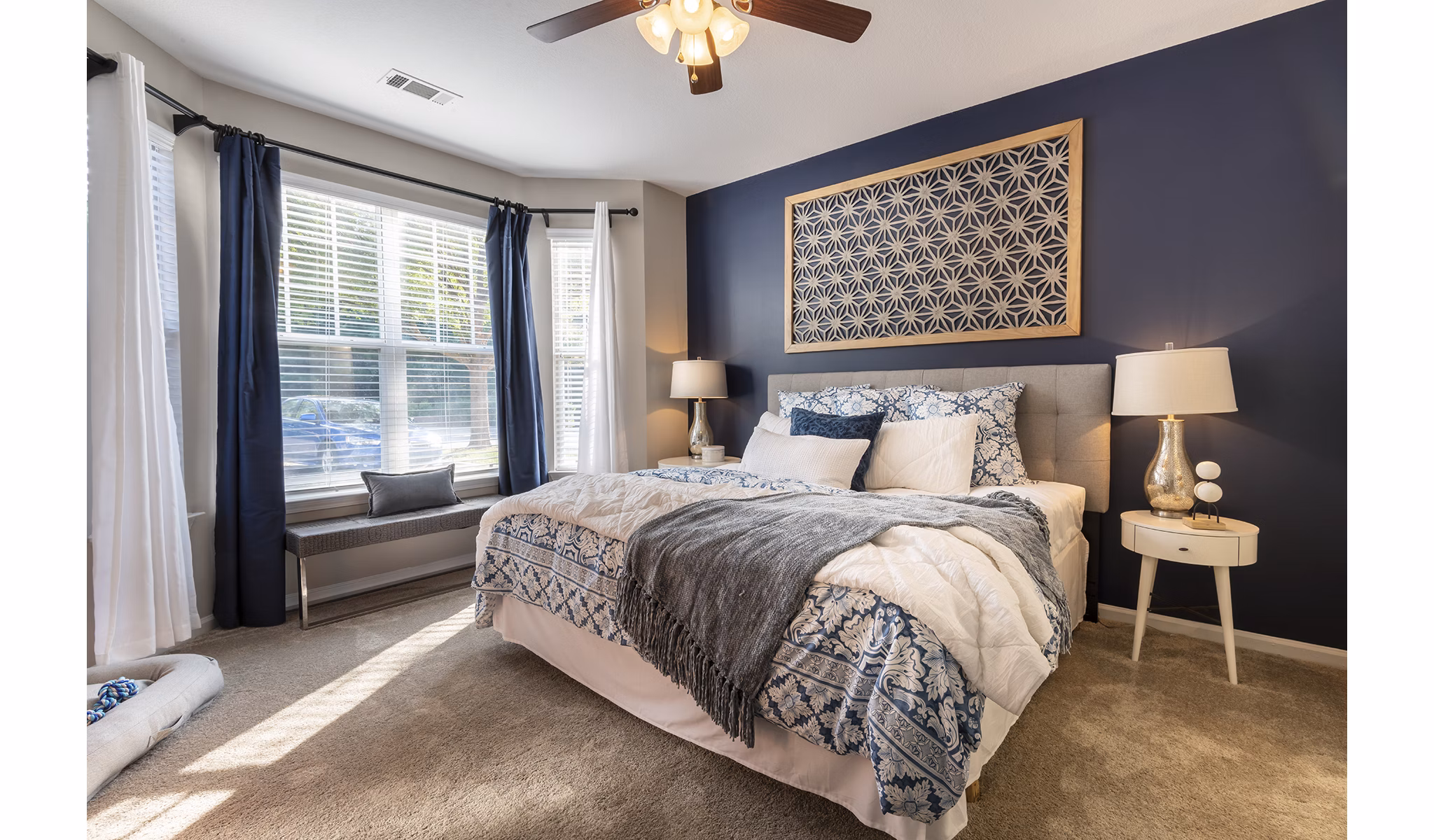 Wakefield Glen Apartments: Cozy bedroom with modern decor and ample natural light