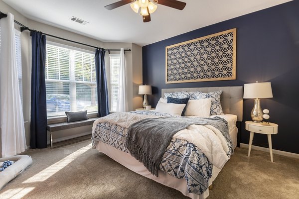 Wakefield Glen Apartments: Cozy bedroom with modern decor and ample natural light