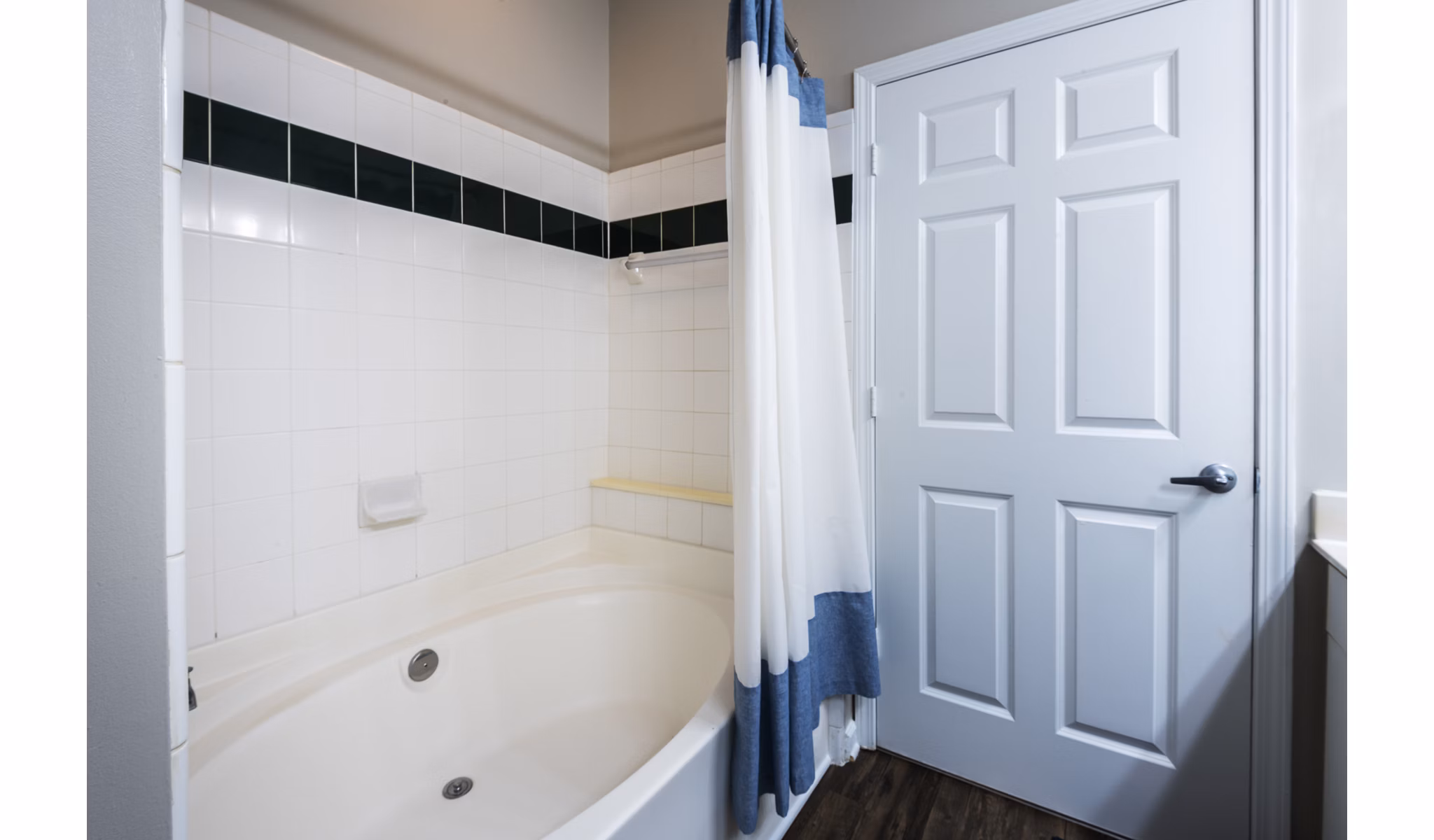 Luxurious bathroom with modern fixtures at Wakefield Glen Apartments, showcasing granite countertops and contemporary design