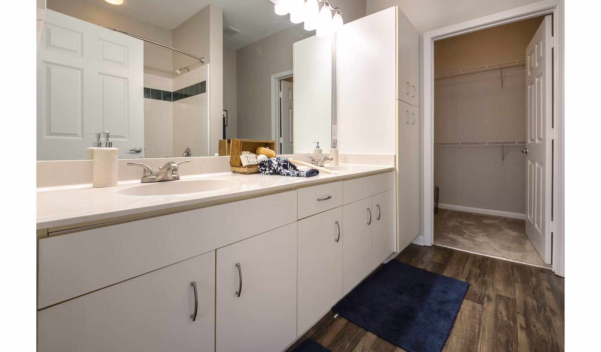 Modern bathroom with marble countertops and sleek fixtures at Wakefield Glen Apartments, luxury living in Raleigh