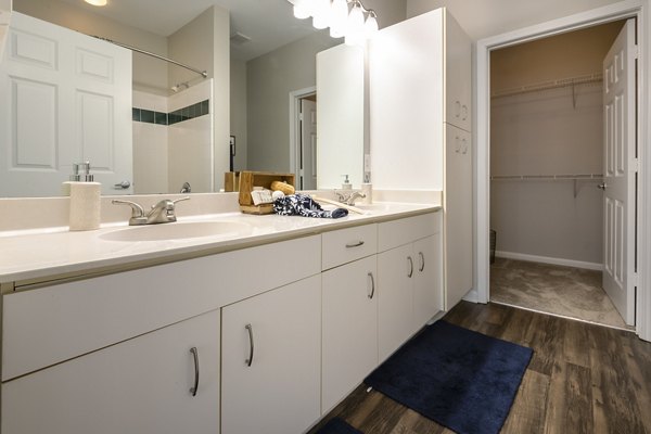 Modern bathroom with marble countertops and sleek fixtures at Wakefield Glen Apartments, luxury living in Raleigh
