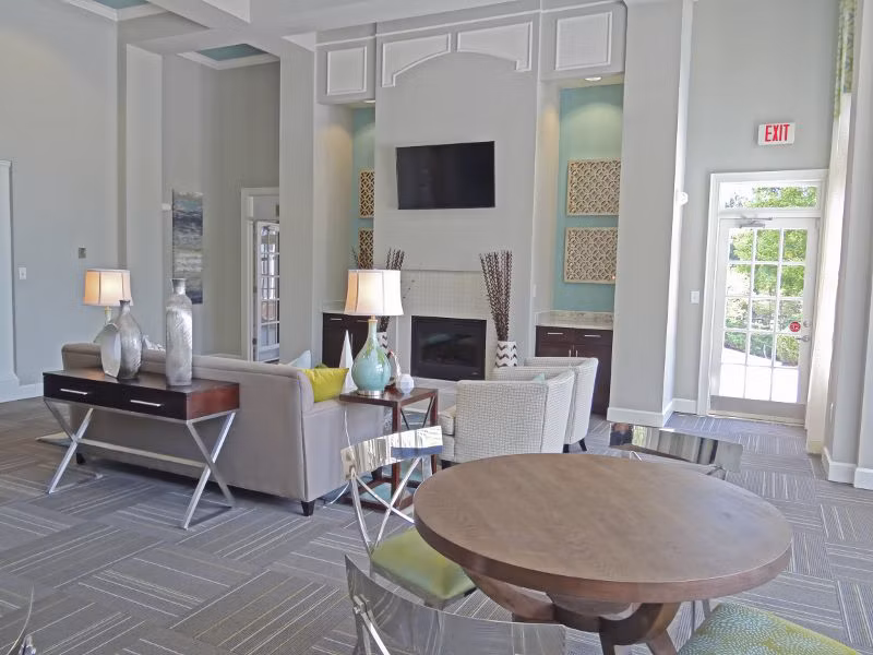 Clubhouse featuring a modern lounge and community space at Wakefield Glen Apartments