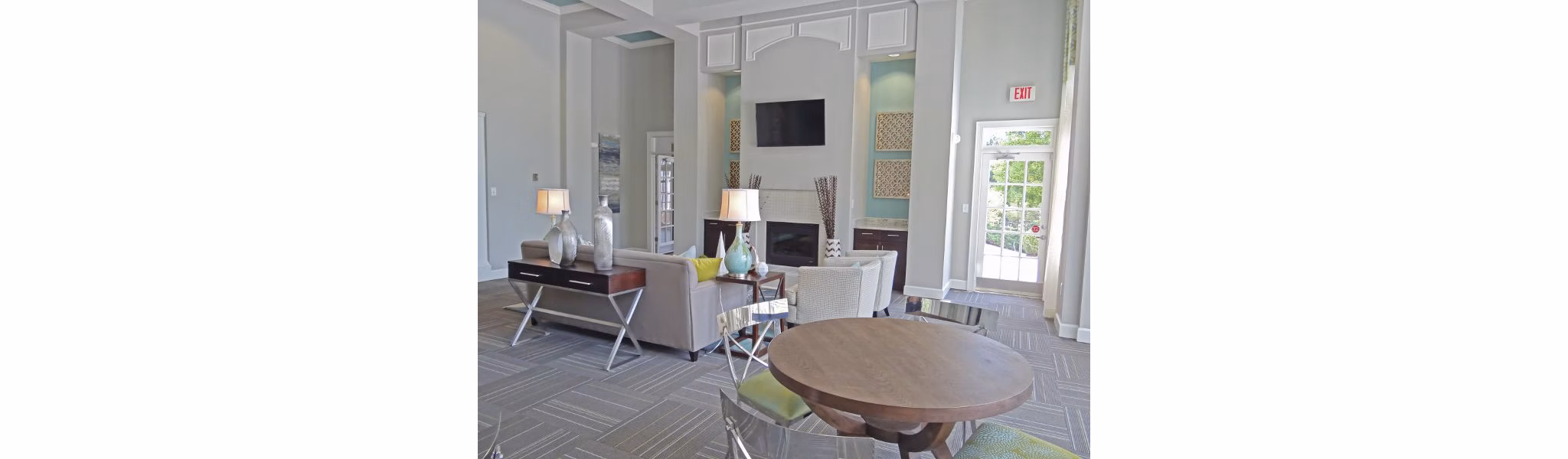 Clubhouse featuring a modern lounge and community space at Wakefield Glen Apartments