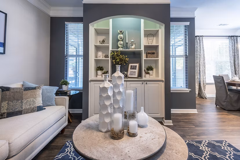 Living room featuring modern furniture and large windows in Wakefield Glen Apartments