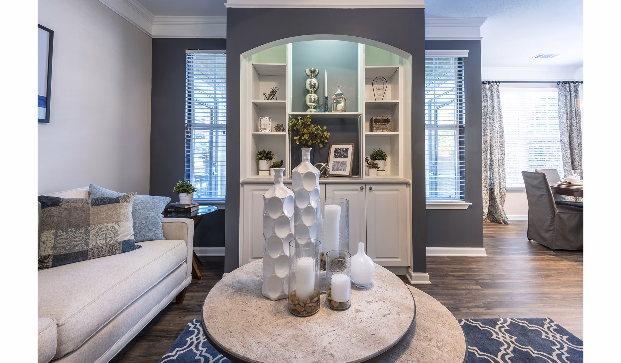Living room featuring modern furniture and large windows in Wakefield Glen Apartments