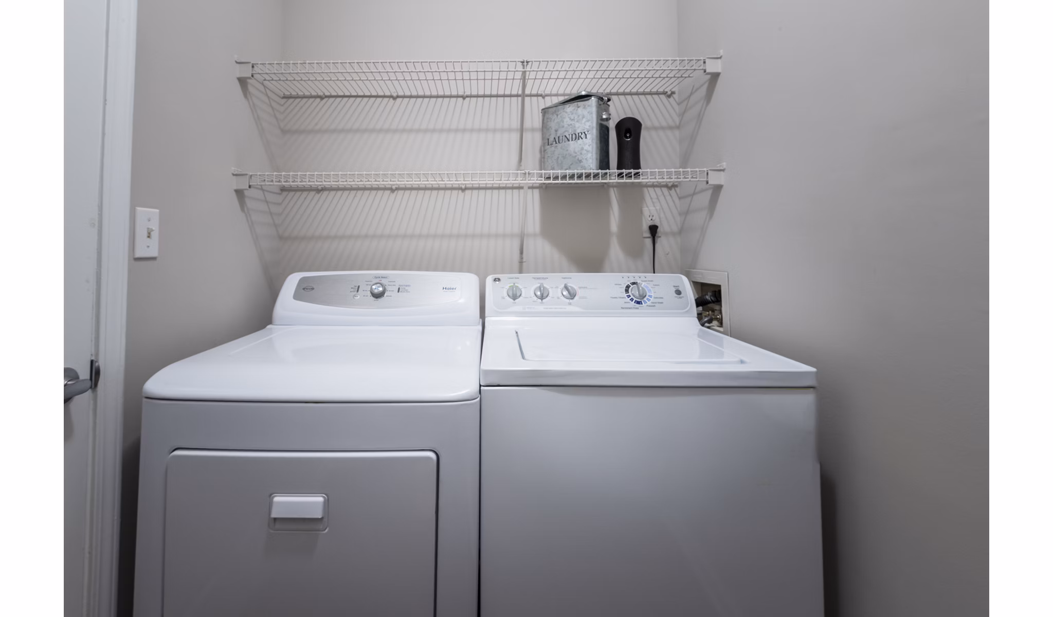 Laundry room with modern appliances in Wakefield Glen Apartments offering convenience in luxury living