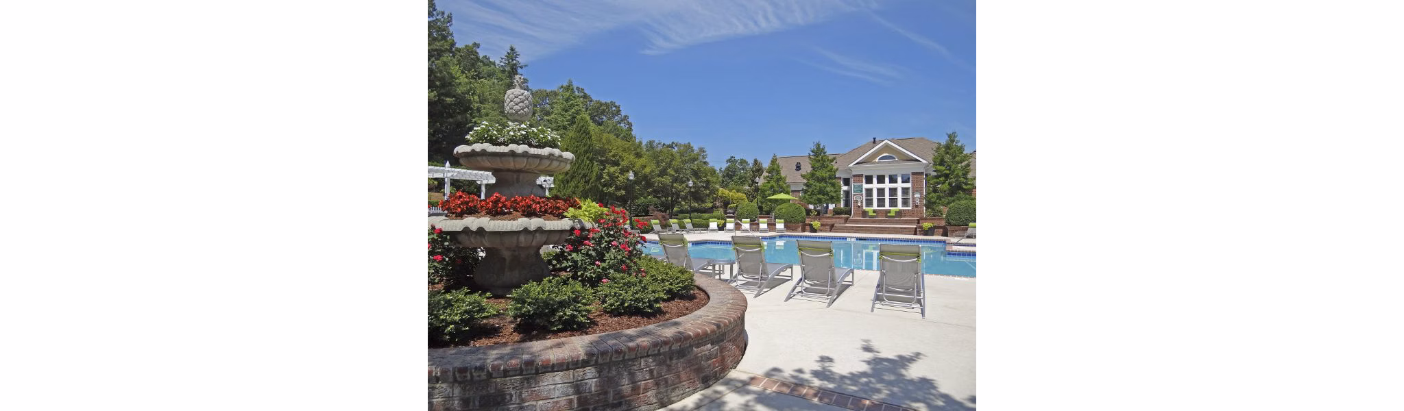 Tranquil outdoor pool at Wakefield Glen Apartments offering relaxation in a luxurious Greystar community setting