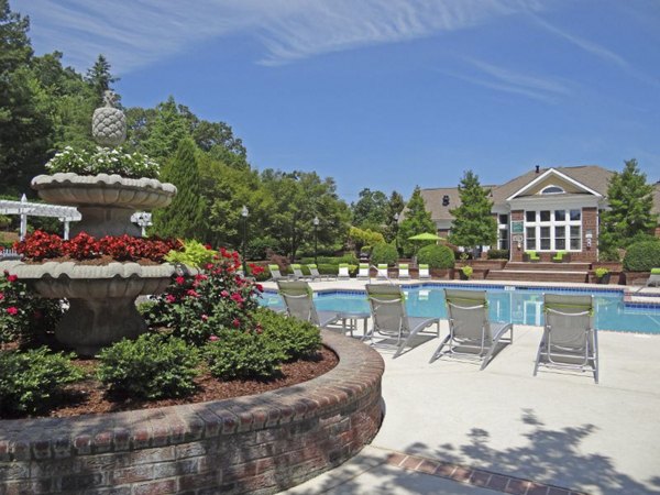 Tranquil outdoor pool at Wakefield Glen Apartments offering relaxation in a luxurious Greystar community setting