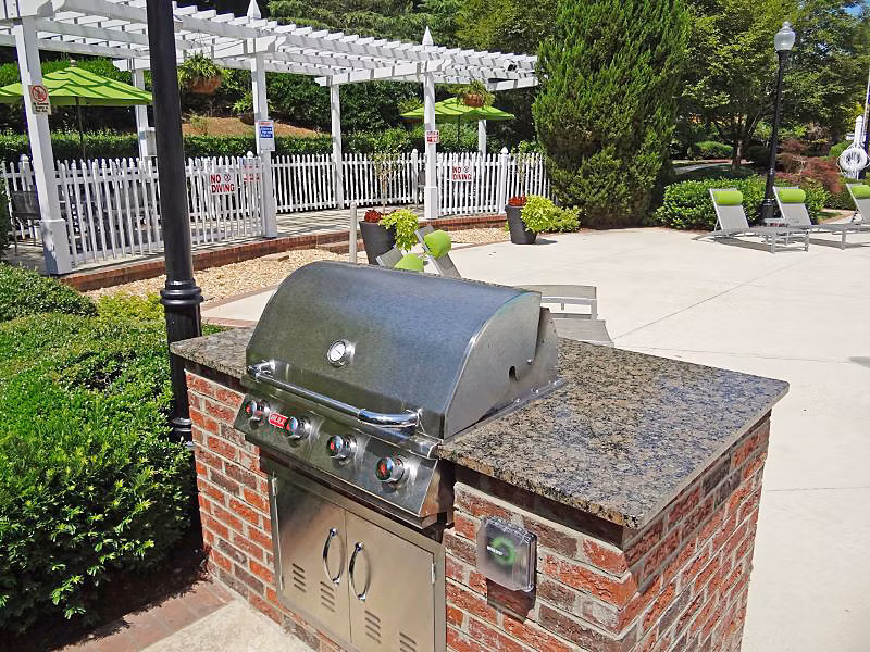 Outdoor grill area with modern design at Wakefield Glen Apartments, perfect for hosting gatherings and enjoying outdoor cooking