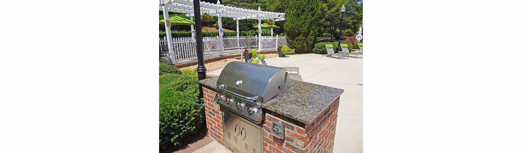 Outdoor grill area with modern design at Wakefield Glen Apartments, perfect for hosting gatherings and enjoying outdoor cooking