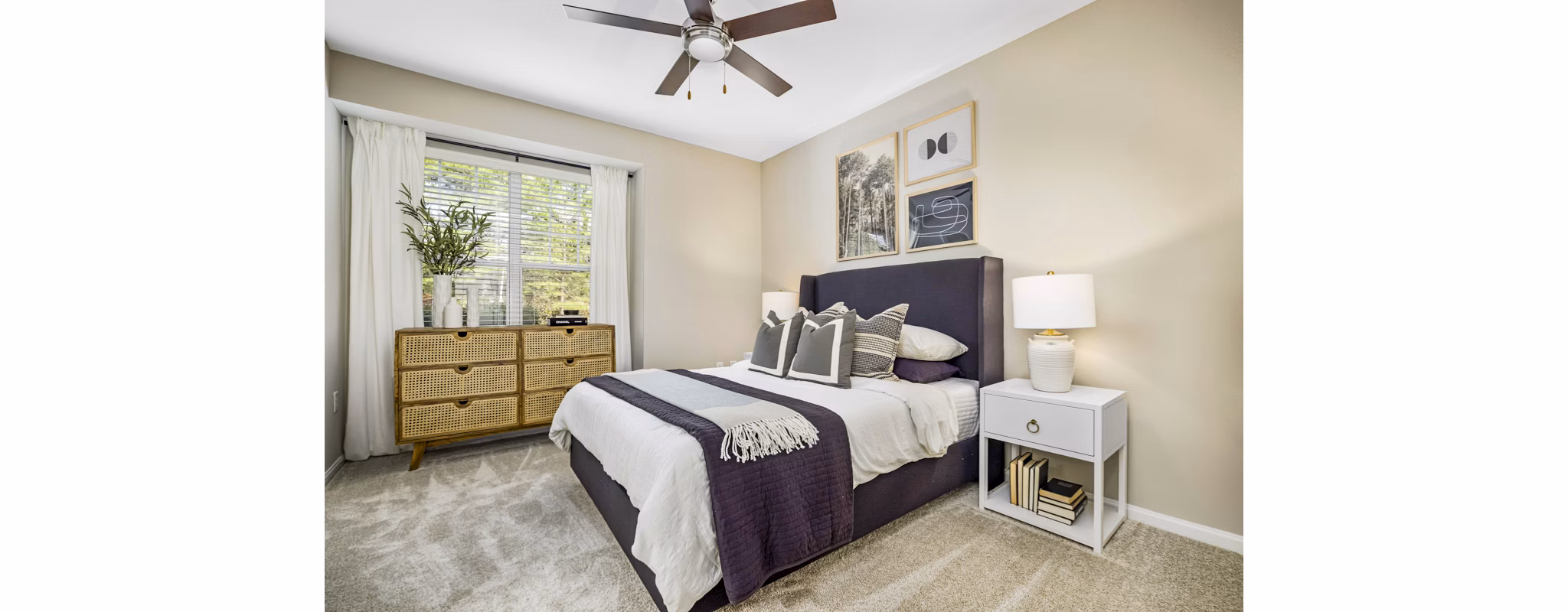 Cozy bedroom with modern decor at Tradition at Stonewater luxury apartments