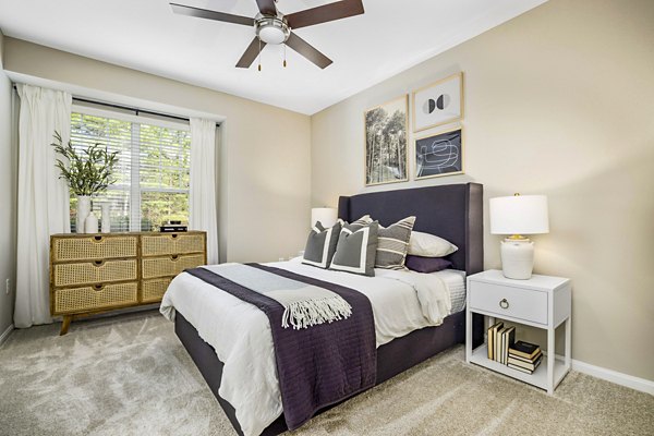 Cozy bedroom with modern decor at Tradition at Stonewater luxury apartments