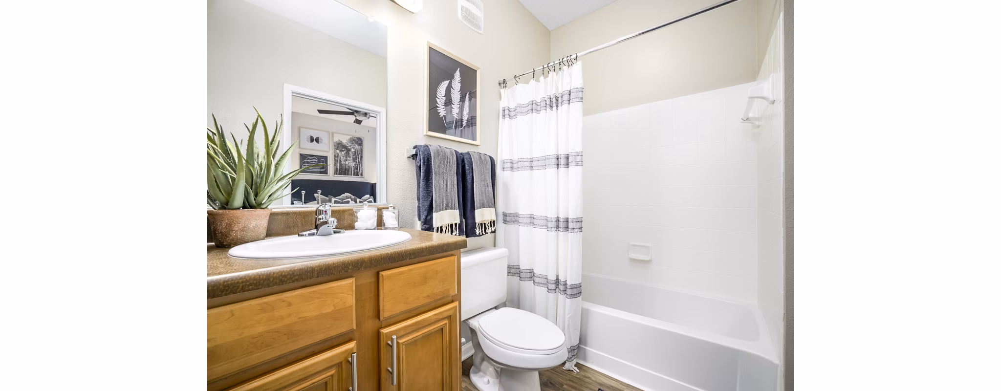 Elegant bathroom with marble countertops and modern fixtures at Tradition at Stonewater Apartments