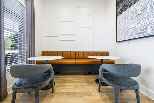Elegant clubhouse with modern decor at Tradition at Stonewater Apartments, ideal for social gatherings and community events Luxury amenities in a tranquil setting