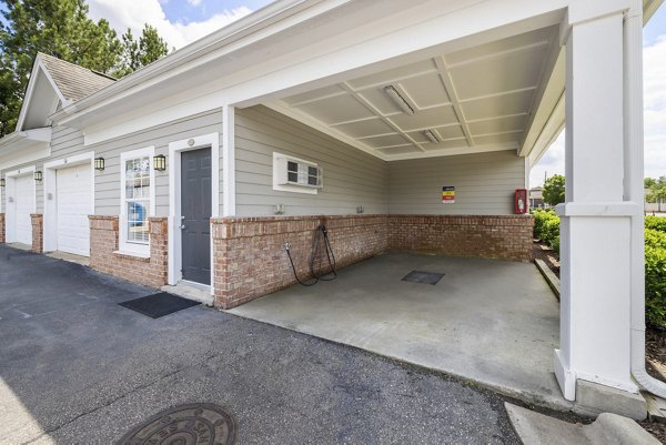 Car care station at Tradition at Stonewater Apartments offering vehicle maintenance amenities
