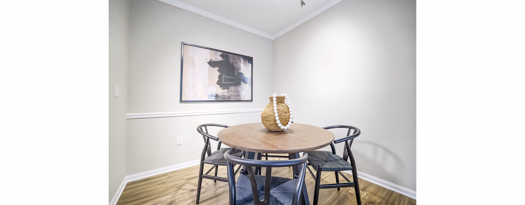 Dining room with elegant decor and large windows at Tradition at Stonewater Apartments