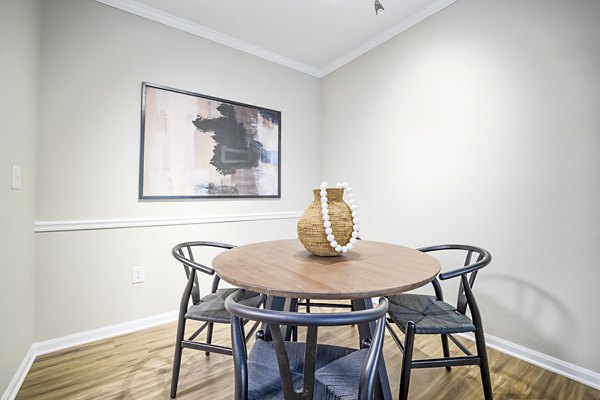 Dining room with elegant decor and large windows at Tradition at Stonewater Apartments
