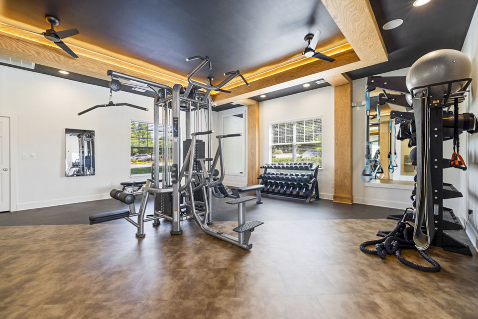 State-of-the-art fitness center with modern equipment at Tradition at Stonewater Apartments for active living enthusiasts