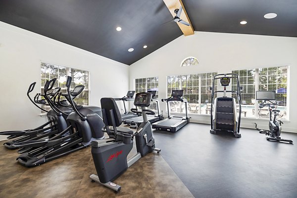 Fitness center with modern equipment at Tradition at Stonewater Apartments Enjoy premium workout facilities in a luxury living environment