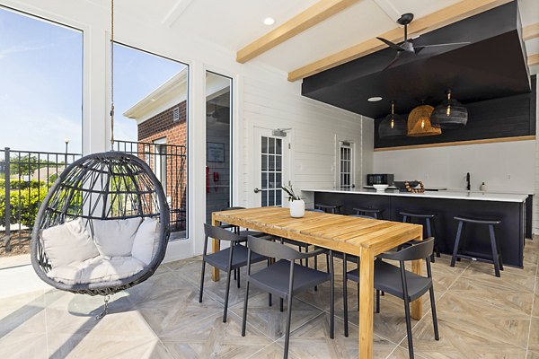 Spacious patio with comfortable seating at Tradition at Stonewater Apartments