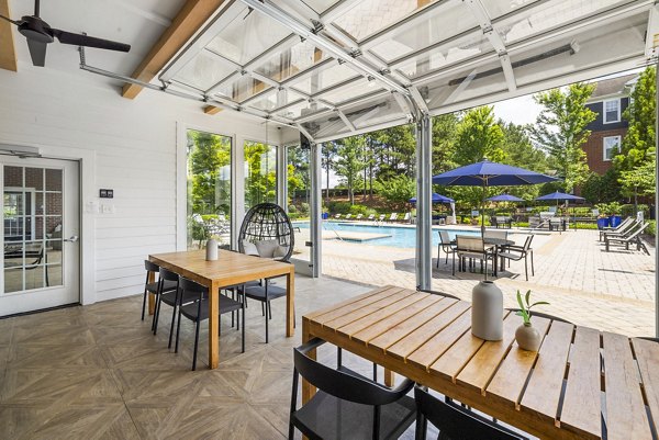 Modern outdoor patio with stylish seating at Tradition at Stonewater Apartments
