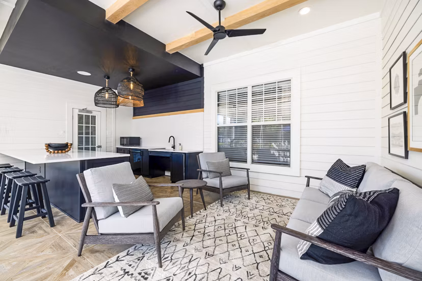Charming outdoor patio with modern furniture at Tradition at Stonewater Apartments, perfect for relaxation and social gatherings