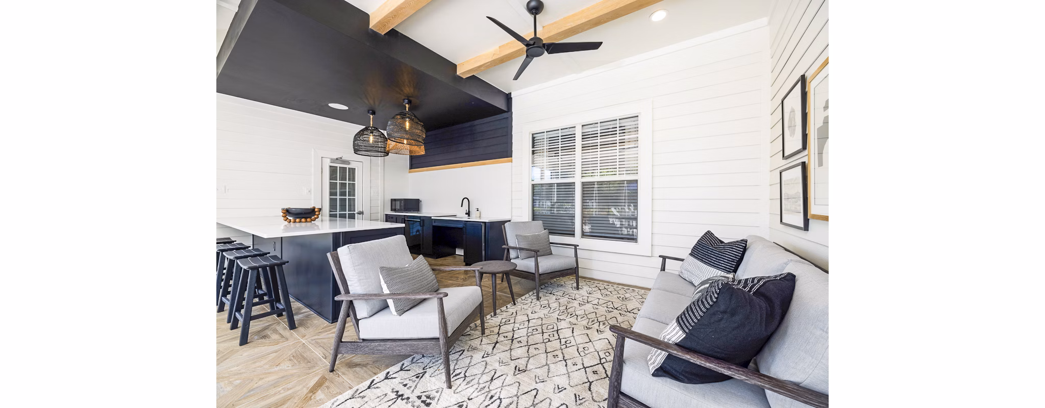 Charming outdoor patio with modern furniture at Tradition at Stonewater Apartments, perfect for relaxation and social gatherings