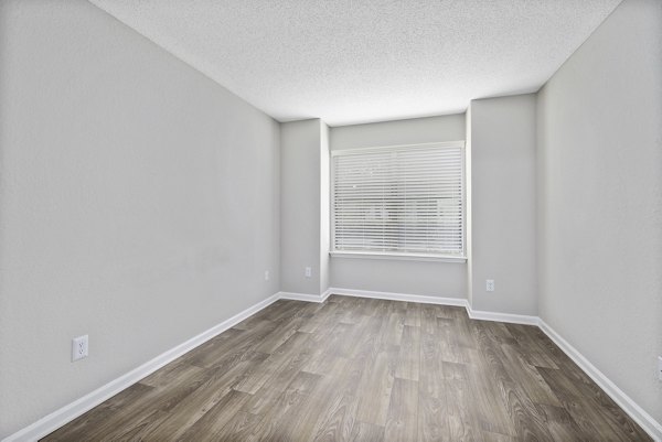 Cozy bedroom with elegant decor at Sailboat Bay Apartments