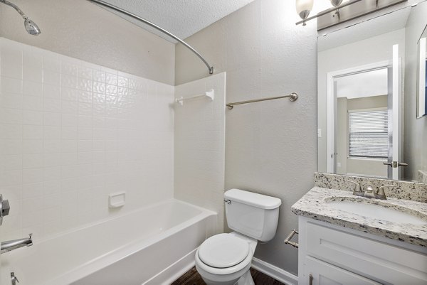 Modern bathroom with marble countertops at Sailboat Bay Apartments