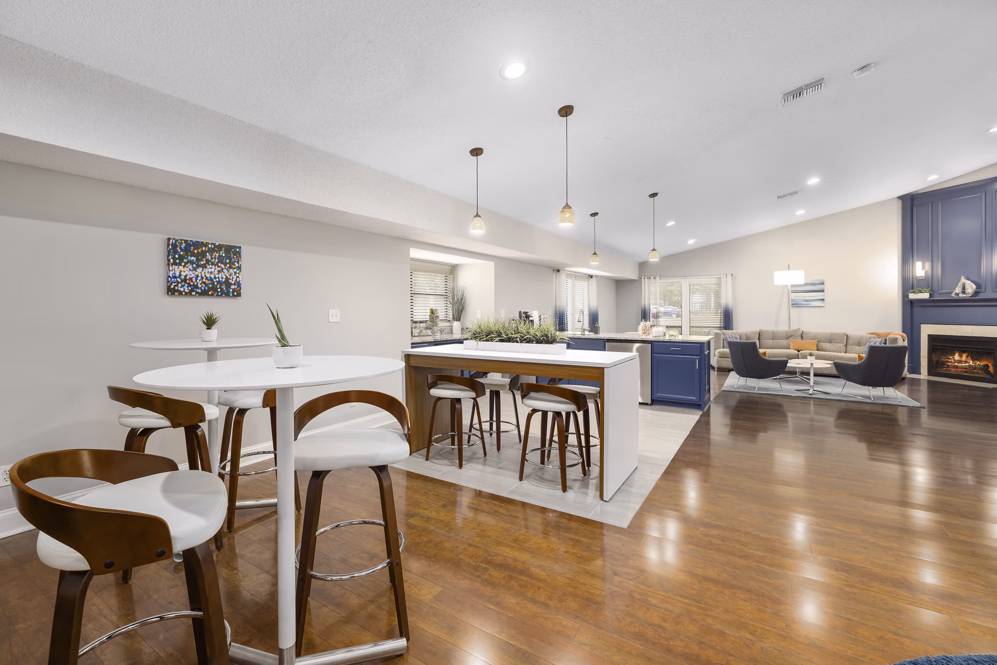 Modern clubhouse with lounge seating and pool table at Sailboat Bay Apartments