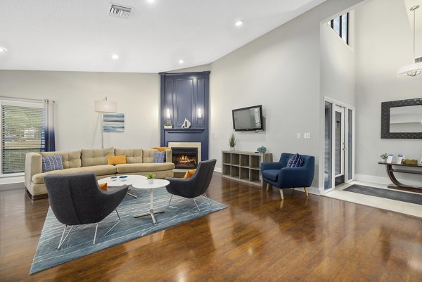 Clubhouse with modern decor and seating at Sailboat Bay Apartments, featuring luxury amenities and community spaces