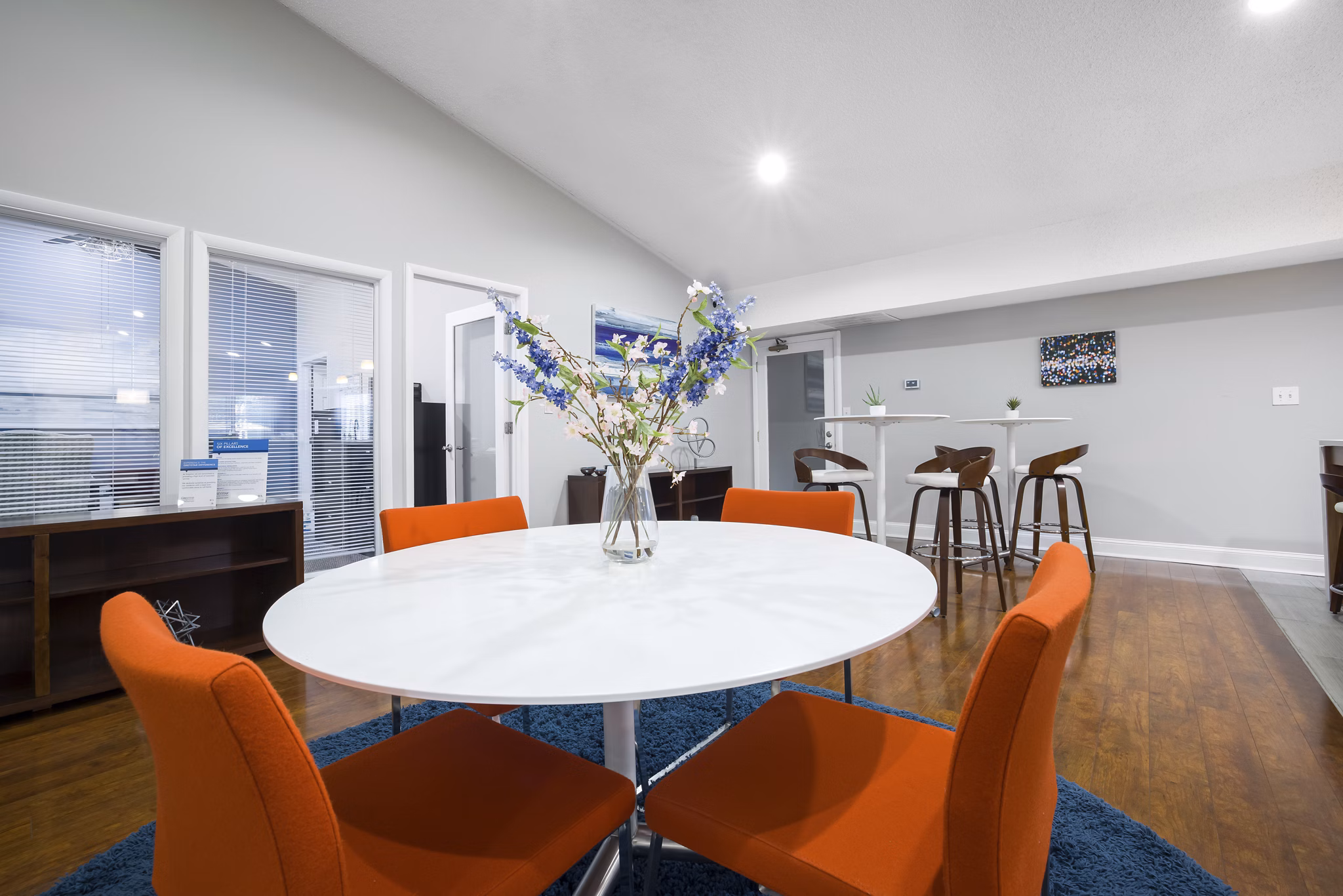 Elegant clubhouse with modern decor at Sailboat Bay Apartments, offering luxurious social spaces for residents