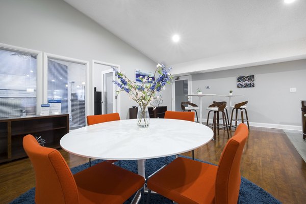 Elegant clubhouse with modern decor at Sailboat Bay Apartments, offering luxurious social spaces for residents