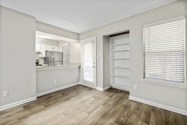 Dining area with modern decor and natural lighting at Sailboat Bay Apartments, a luxurious living space in a desirable location